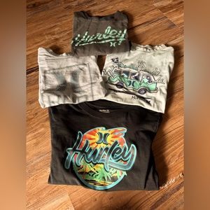 A set of 4 Boys Hurley Shirts. In good to new condition. Size Medium.